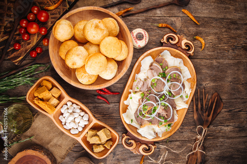 Kazakh traditional dishes beshbarmak with horse meat baursaks photo