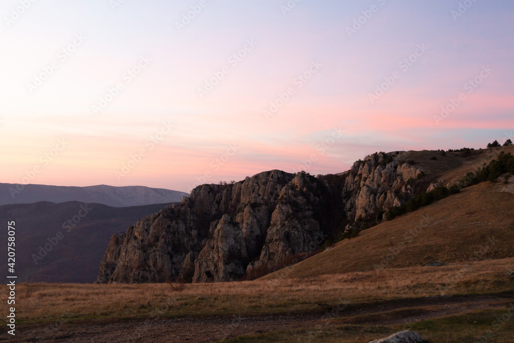 Evening mountain landscape, sunset pink-purple sky of Demerdzhi