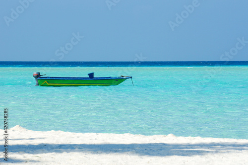 vintage colorful boat on turquoise water