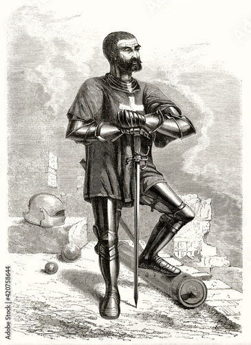 knight of Rhodes posing with armor supporting himself with the sword and uncovered head no helm. Pose suggests loyalty and braveness. Grey tone etching style art by Pannemaker, Le Tour du Monde, 1862 photo