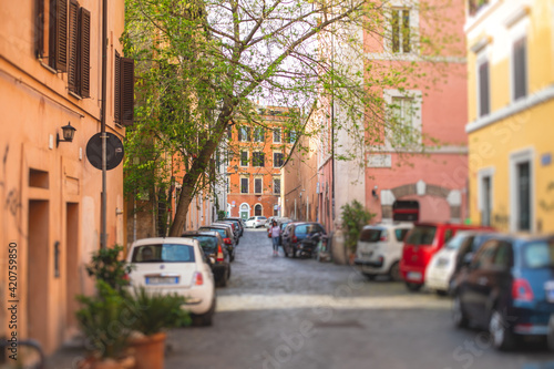 Trastevere district, Rome, Italy, view of rione Trastevere, Roma, with historical narrow streets, Municipio I, west bank of Tiber in Rome, Lazio, Italy, cozy streets with restaurants and architecture © tsuguliev