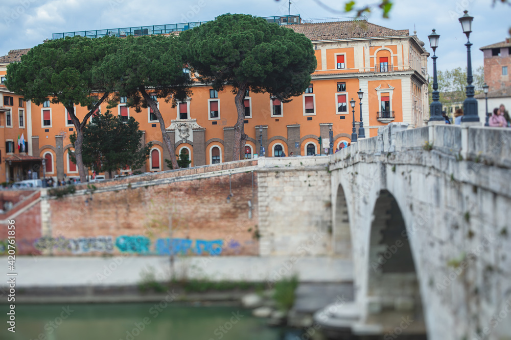 Tiber Island, Rome, Lazio, Italy, view of isola Tiberina, an island in Tiber river, with Fatebenefratelli Hospital and Ponte Fabricio bridge, summer view, Italia