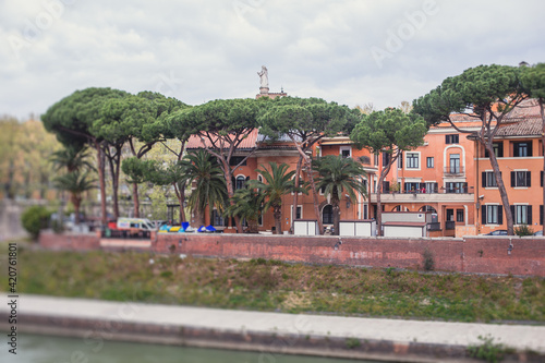 Tiber Island, Rome, Lazio, Italy, view of isola Tiberina, an island in Tiber river, with Fatebenefratelli Hospital and Ponte Fabricio bridge, summer view, Italia photo