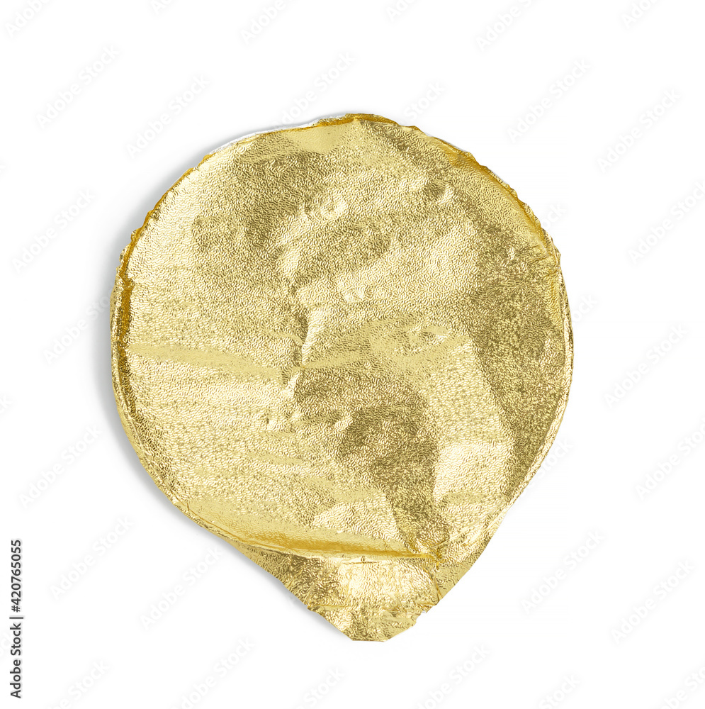 round golden aluminum thin lid for plastic yogurt jars on a white background round golden aluminum thin lid for plastic yogurt jars on a white background