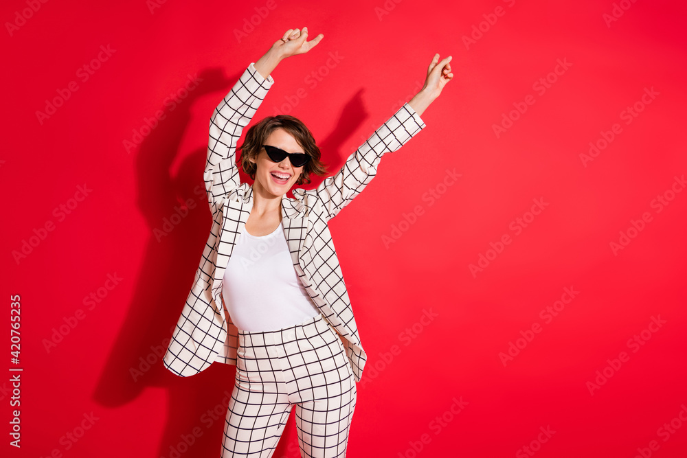 Photo of young excited girl happy positive smile enjoy have fun dance disco isolated over red color background Photo of young excited girl happy positive smile enjoy have fun dance disco isolated over red color background
