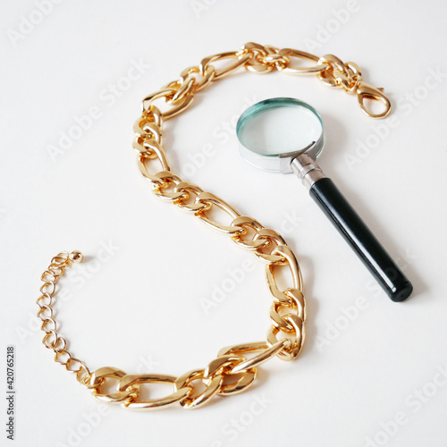 big golden chain on white background, pawnshop concept, jewerly shop concept