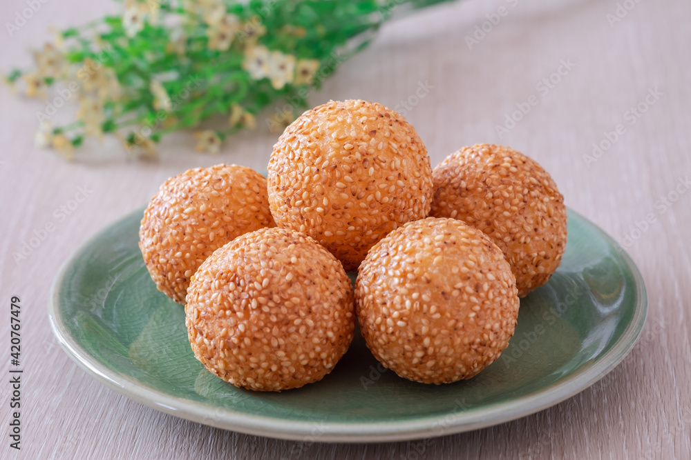Sesame seed balls on green plate.. Sesame seed balls on green plate..