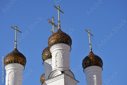 Domes of Church of St. Nicholas against blue clear sky,   1st Golutvinsky lane, Moscow, Russia photo