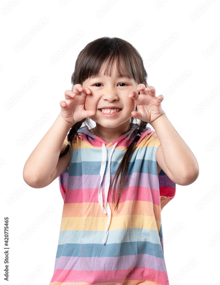 Little girl child showing front teeth with big smile. Healthy happy funny smiling face young adorable lovely. Portrait of happy little asian girl smile on white background Little girl child showing front teeth with big smile. Healthy happy funny smiling face young adorable lovely. Portrait of happy little asian girl smile on white background