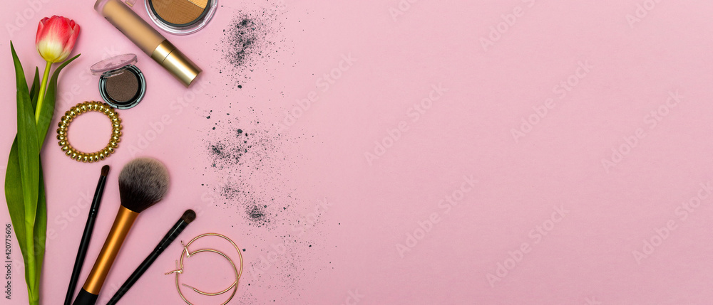 Make up the essentials. A set of professional makeup brushes and cosmetics on a pink background. - obrazy, fototapety, plakaty 