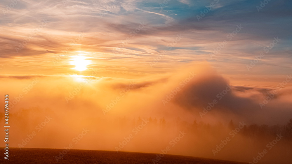 Beautiful sunset above the clouds near Kostenz, Bavarian forest, Bavaria, Germany