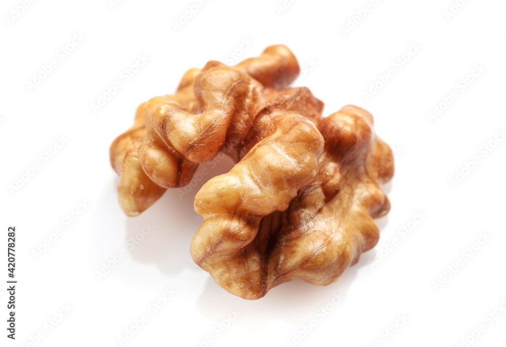 Single golden walnut kernel isolated on white Single golden walnut kernel isolated on white