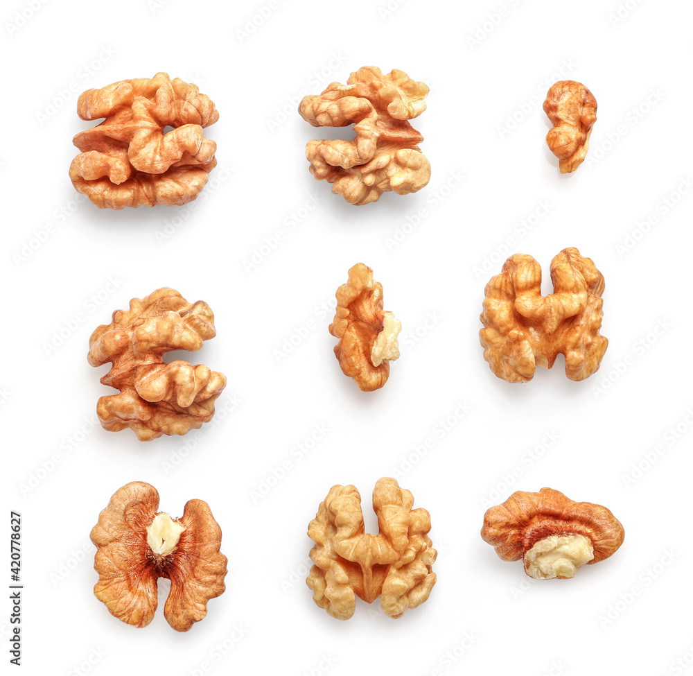 Golden nutritious walnut kernels isolated on white Golden nutritious walnut kernels isolated on white
