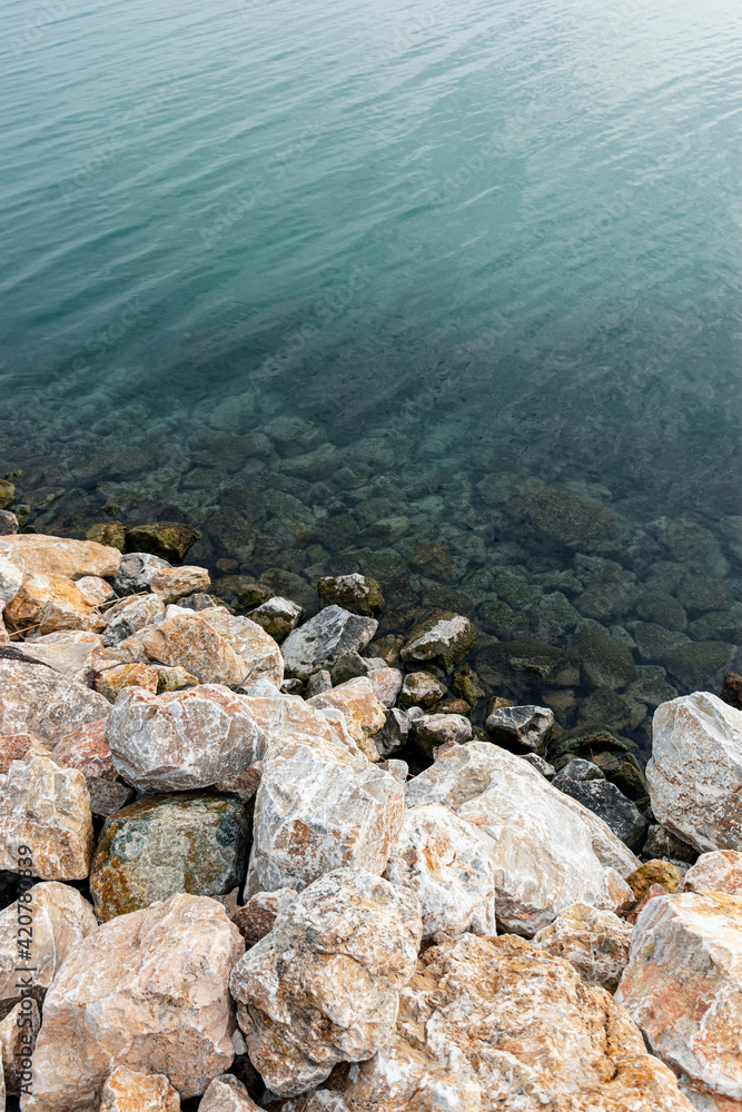 Rocks and blue water, Shore of the lake Balaton.