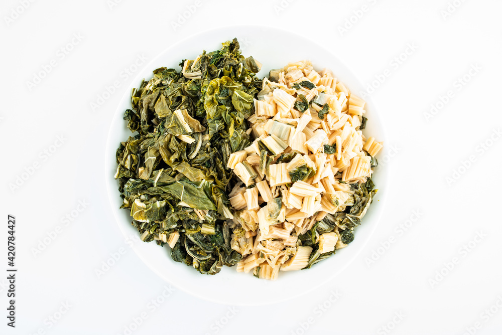 Chopped dried cabbage on a dish on white background Chopped dried cabbage on a dish on white background