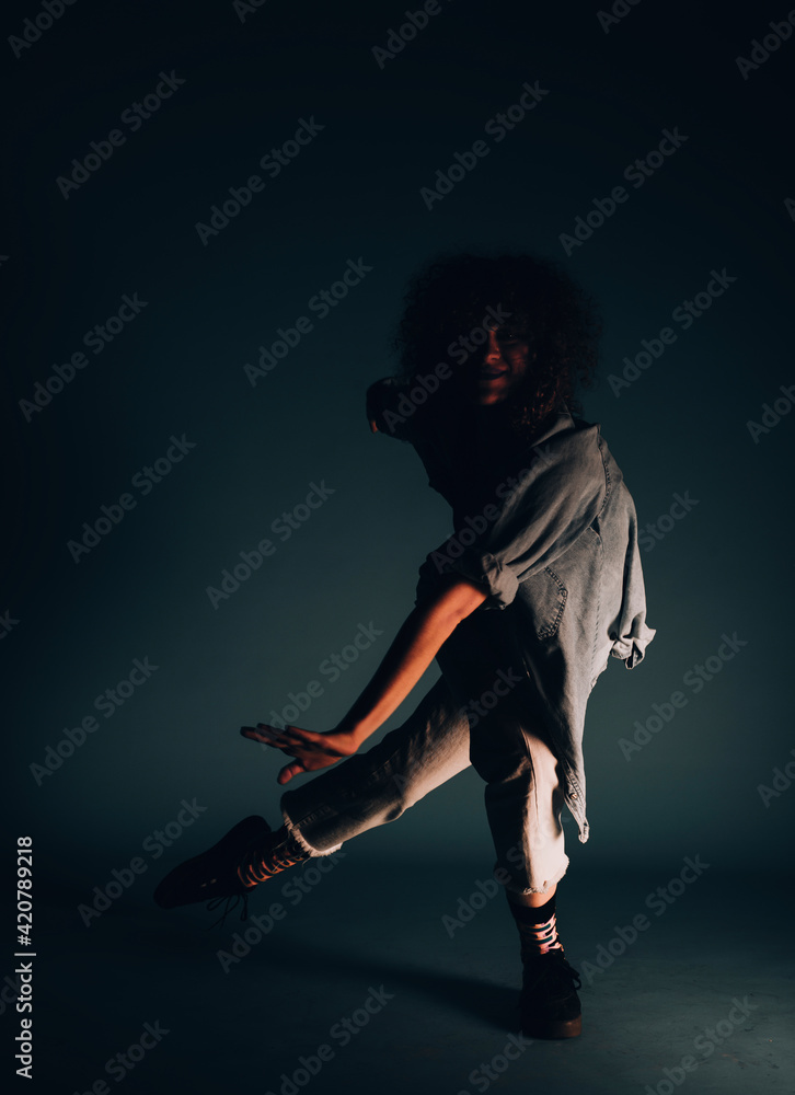 Stylish contemporary dance isolated on dark background