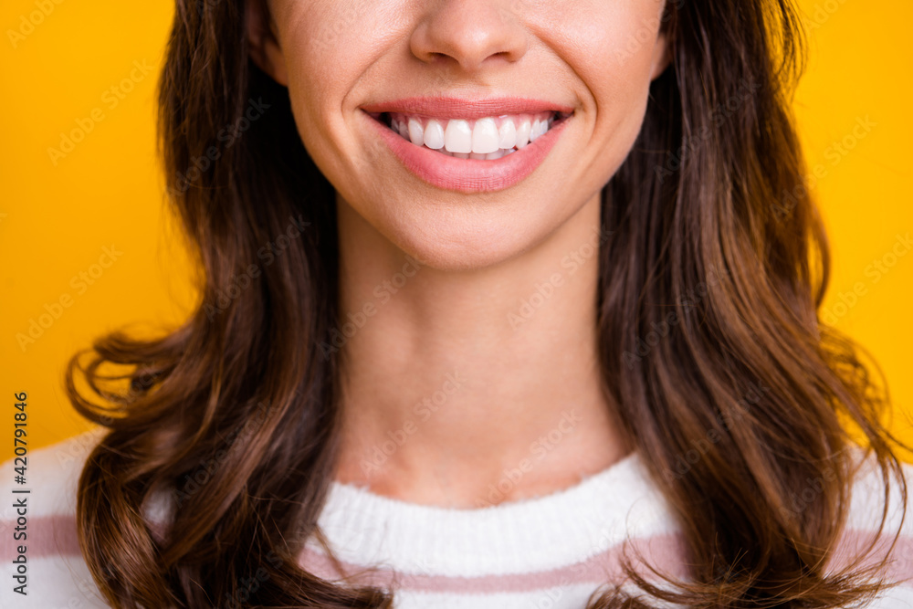 Cropped photo of young girl brown hair happy smile white perfect teeth oral care stomatology isolated over yellow color background Cropped photo of young girl brown hair happy smile white perfect teeth oral care stomatology isolated over yellow color background