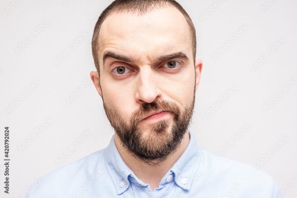Very upset bearded man, sadness on the face of the bearded man, close-up Very upset bearded man, sadness on the face of the bearded man, close-up