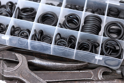 A set of rubber O-rings for pneumatics and hydraulics and old locksmith tools.