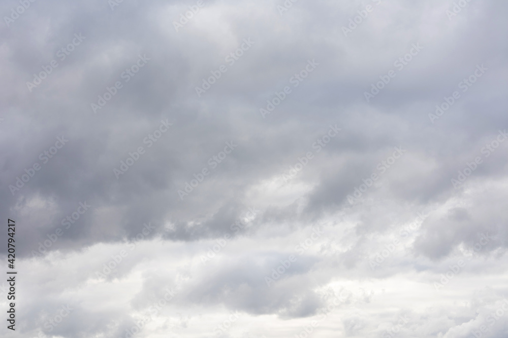 Grey sky with fluffy clouds, abstract background Grey sky with fluffy clouds, abstract background