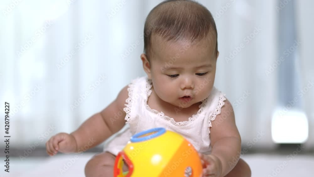 Asian baby cute in the living room at home with family. Asian baby cute in the living room at home with family.