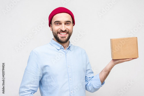 Wallpaper Mural Bearded courier with cardboard box, portrait, white background, copy space Torontodigital.ca