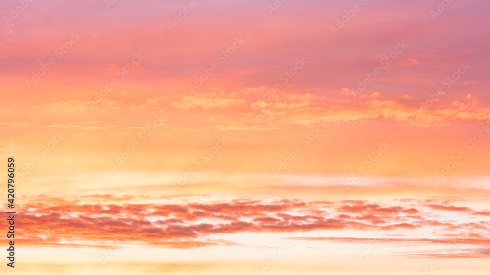 Beautiful orange sky at sunset with clouds, background, 16:9