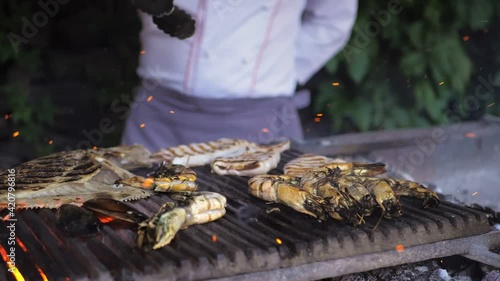 Fresh shrimp grilled by chef in restaurant photo