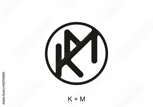 Black KM initial letter in circle
