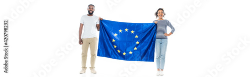 full length view of happy african american couple standing with european union flag on white, banner