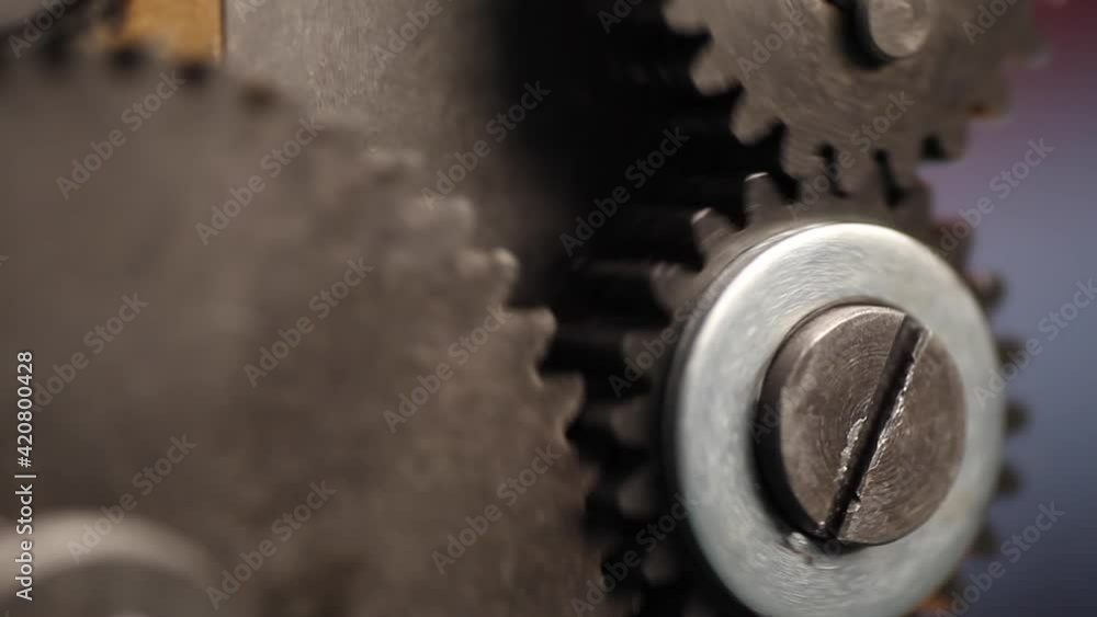 Machine gears on Jewelry rolling mill tool during work jeweler Machine gears on Jewelry rolling mill tool during work jeweler