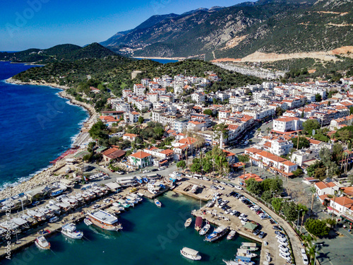 The top view from the drone of Kas resorts and city with amazing blue and clear lagoon and yachts in Mugla province of Turkey © Aleksey