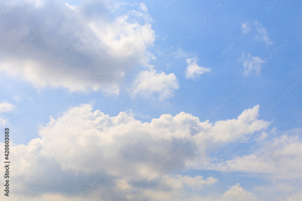 White clouds on the blue sky for background.