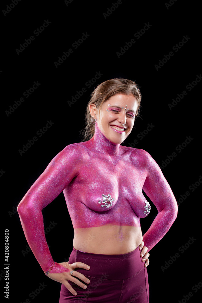 Woman with full body pink paint artwork Woman with full body pink paint artwork