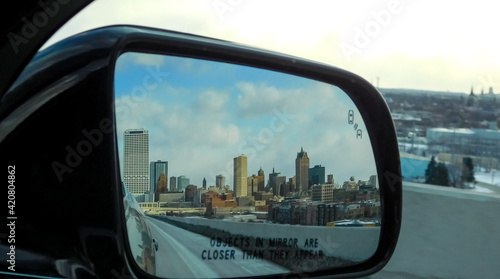City Of Milwaukee In The Rear-view Mirror Of Car