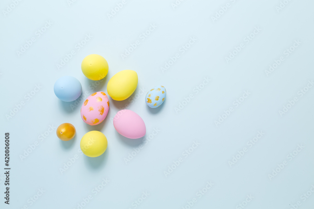 Easter eggs on a blue background with place for text. Flat lay. Easter eggs on a blue background with place for text. Flat lay.