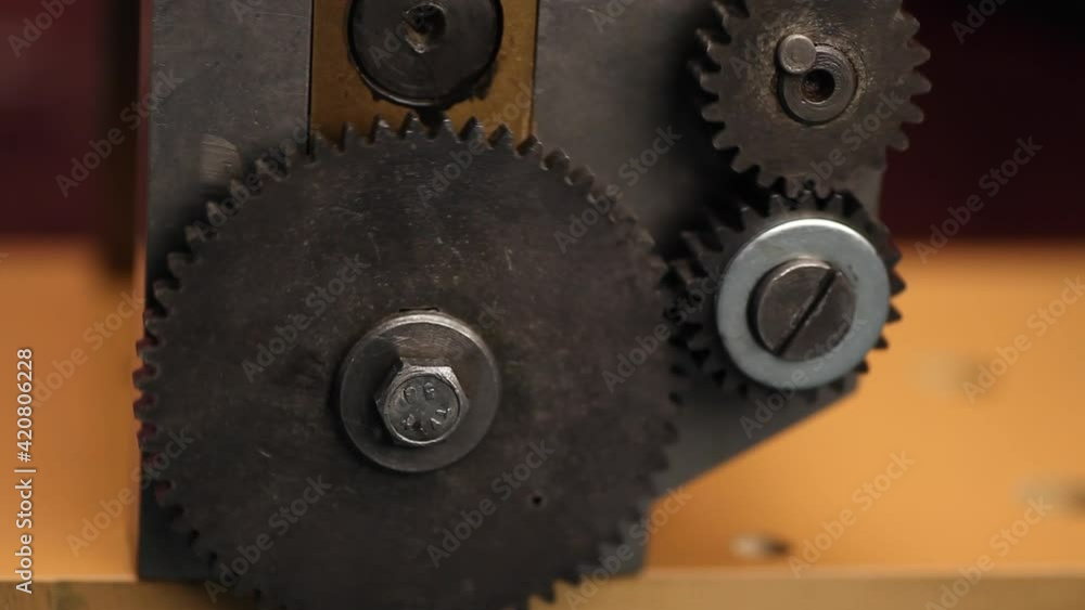 Machine gears on Jewelry rolling mill tool during work jeweler Machine gears on Jewelry rolling mill tool during work jeweler