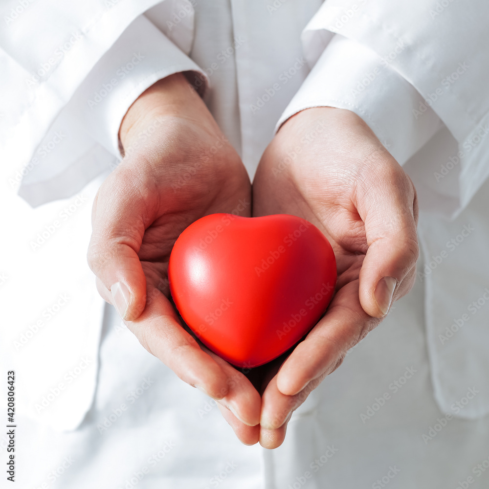 heart symbol is in the doctor s hands. heart symbol is in the doctor s hands.