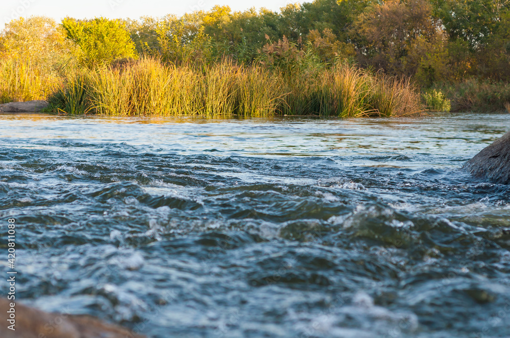 Rocky fast river. Running water, flowing with rapids Rocky fast river. Running water, flowing with rapids