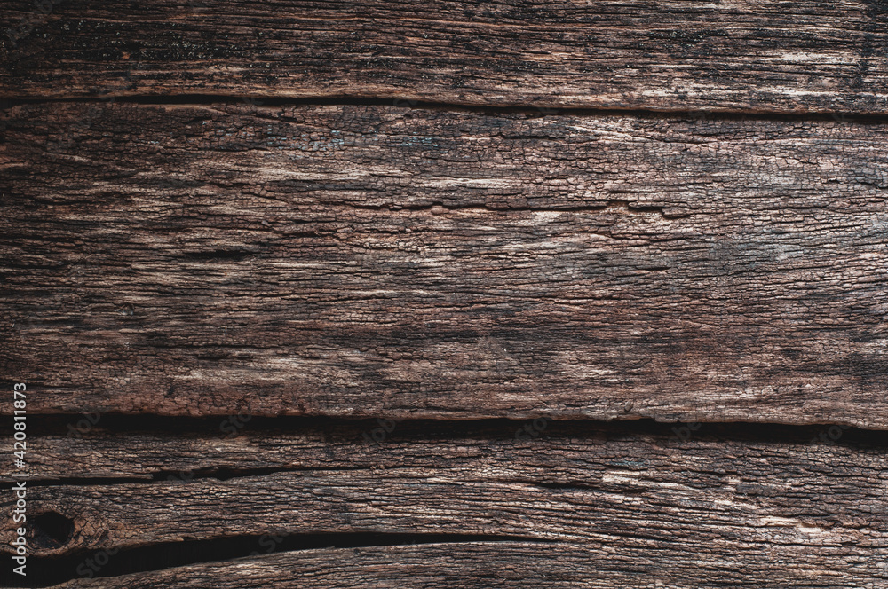 Grunge background. Very old cracked boards, wood that has darkened from time and weathering, close-up wood texturex. Grunge background. Very old cracked boards, wood that has darkened from time and weathering, close-up wood texturex.