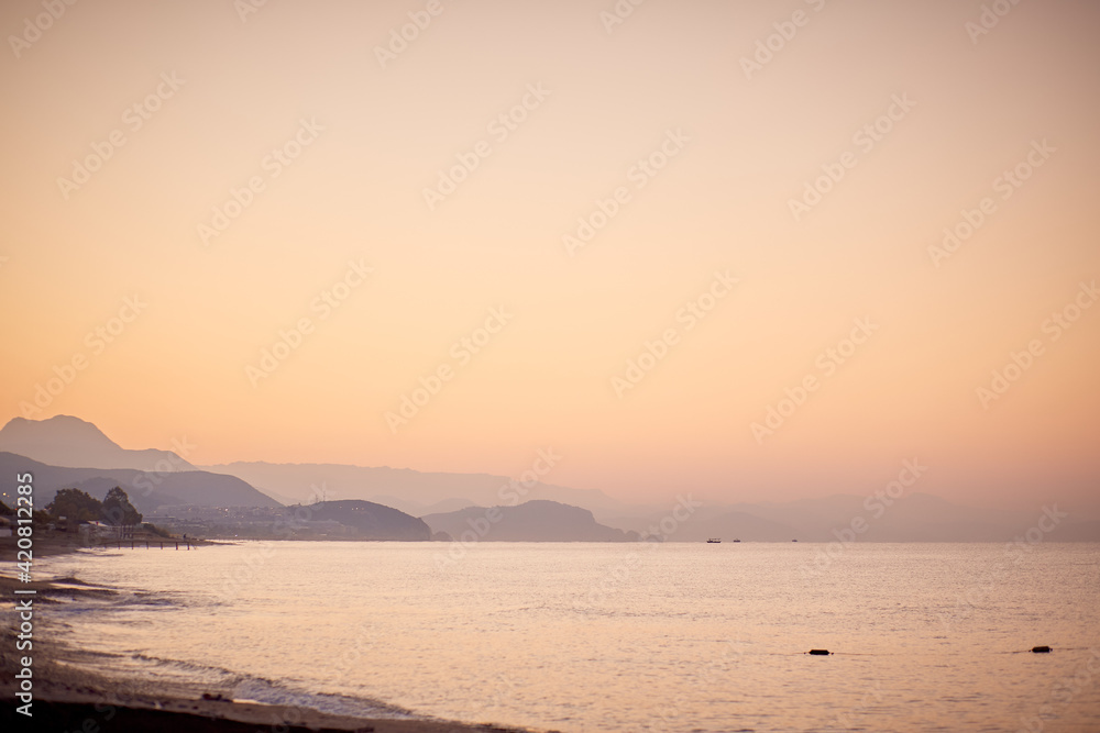 Wonderful landscape of sunrise beach with mountains and Mediterranean Sea