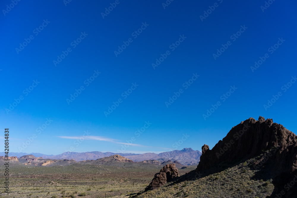 A vibrant view of the mountainous desert landscape with blue sky in Arizona