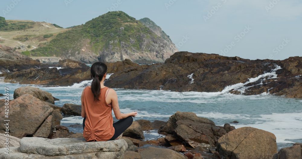 Woman do yoga beside the sea beach Woman do yoga beside the sea beach