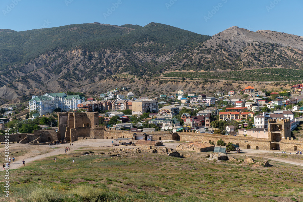 View from the height of the city of Sudak. Mountains can be seen in the background of the city