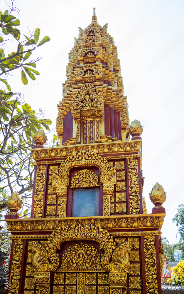 a buddhist golden and yellow monument and temple