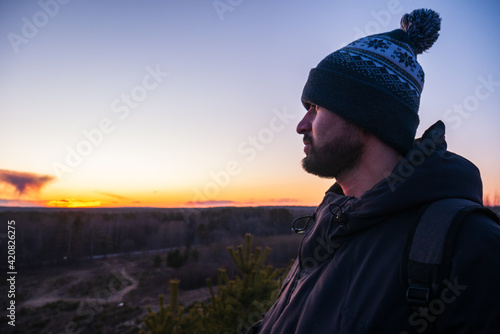 Man with beard in the background of the sun. © Hunman