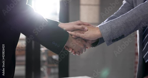 Business people shake hands when reaching future commercial and investment goals.