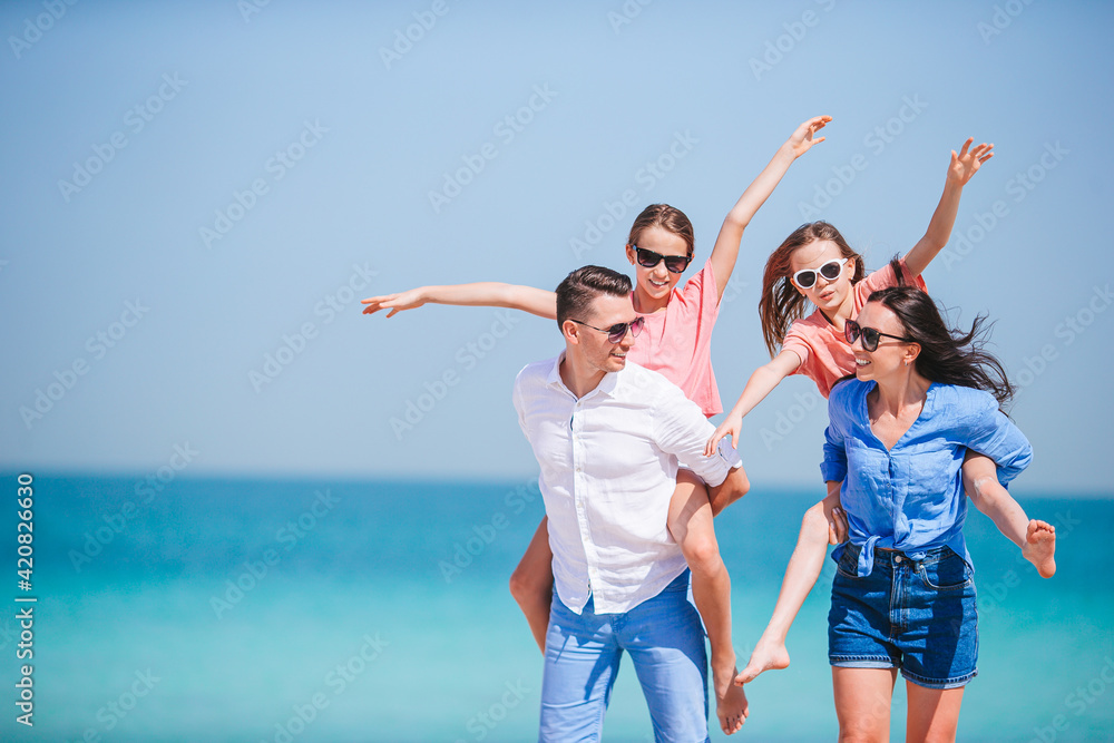 Happy family on the beach during summer vacation Happy family on the beach during summer vacation