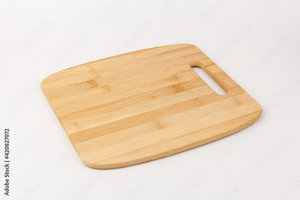 Top view high quality wood cutting board, brown wood. Chopping boards made from natural bamboo. Isolated image kitchen utensil on white background. Top view high quality wood cutting board, brown wood. Chopping boards made from natural bamboo. Isolated image kitchen utensil on white background.