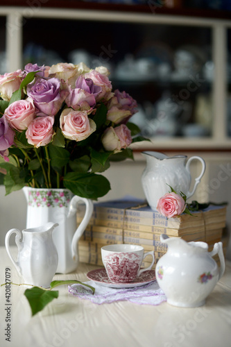 still-life with vintage white ware and pastel roses